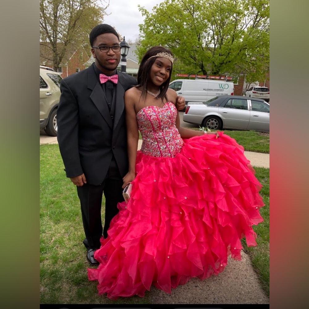 Stunning hot pink prom dress. Heavily embroidered w/hundreds of precious gems.